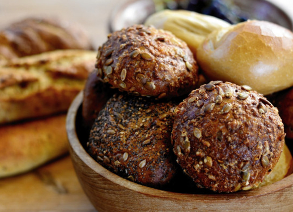 Selection of fresh breakfast rolls on a breakfast table