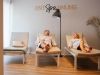 A young couple relaxes on the loungers in the spa area